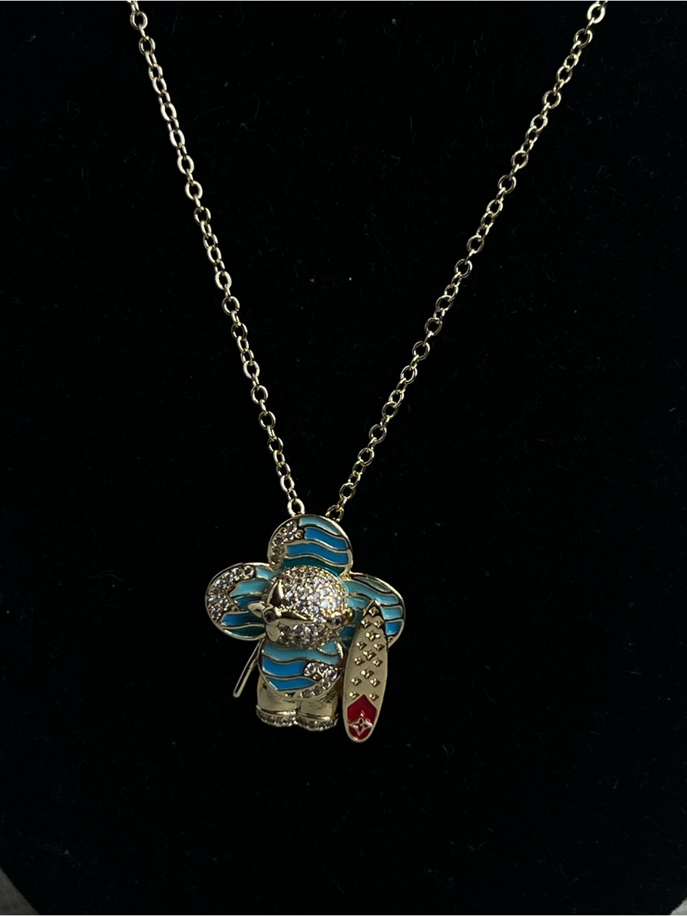 blue surfer floral gold pendant with pavé accents and detailed surfboard - Picture 2 of 5